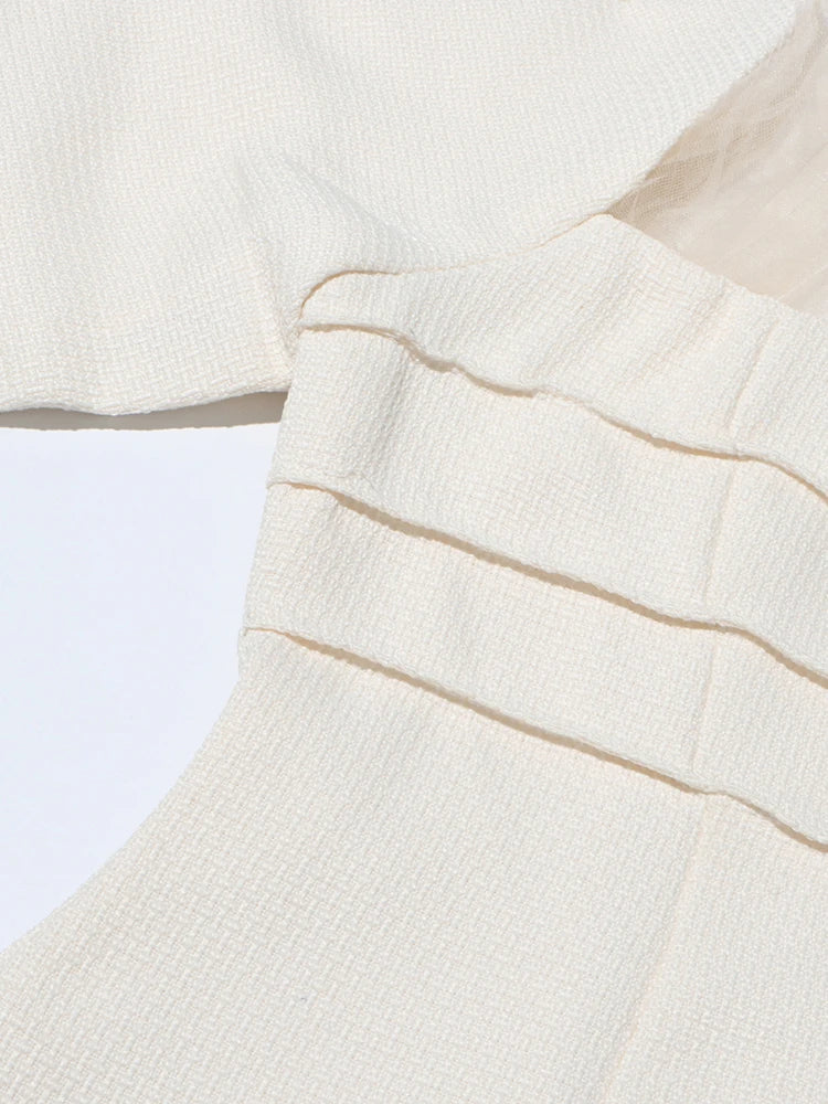 Chic Layers: A Fusion of Textures in White